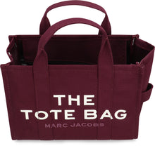 Load image into Gallery viewer, La traduzione di "The Canvas Medium Tote Bag" in italiano è "La borsa a tracolla in tela di media grandezza".
